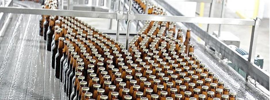 Bottled beverages moving along a conveyor line